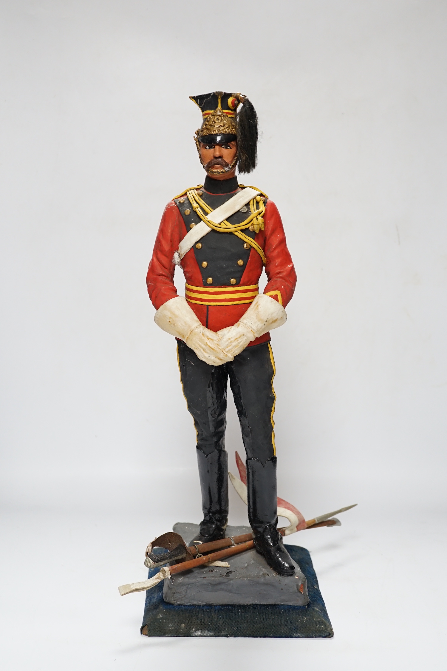 A painted plaster figure of a lancer, 48cm